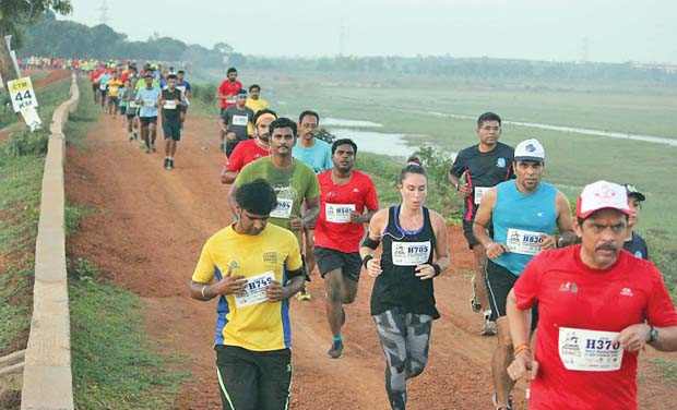 Participants of the trail run organised by Chennai Trekking Club pacing through fields on Sunday. Participants of the trail run organised by Chennai Trekking Club pacing through fields on Sunday.